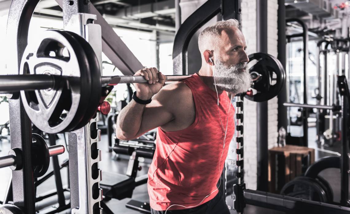MX - 1140x700 -Older man in the gym doing weights.jpg